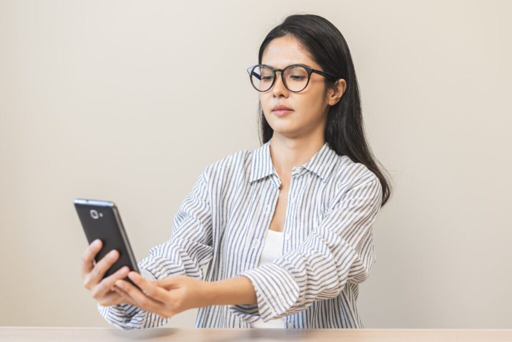 Woman wearing reading glasses. 